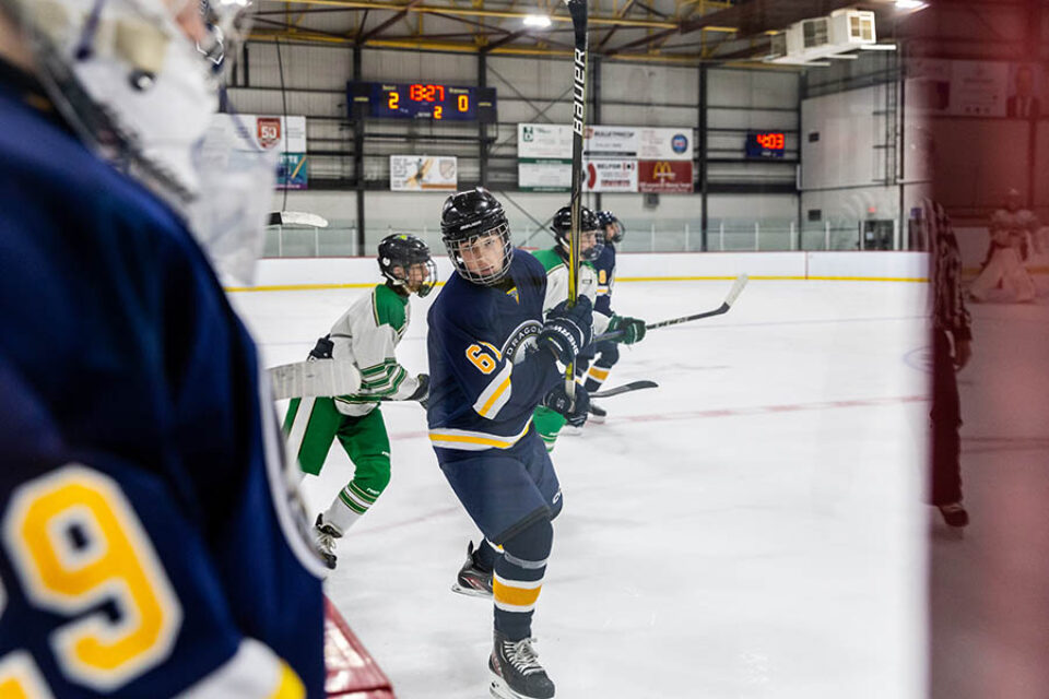 Player subbed-out during hockey game - Montreal college sports photography