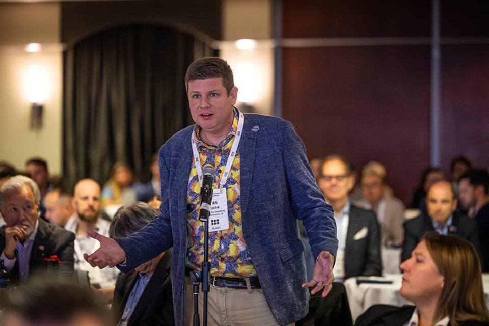 Conference delegate asks question from audience