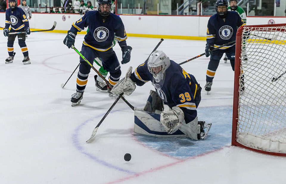 Montreal college sports photography - hockey goalkeeper makes a save