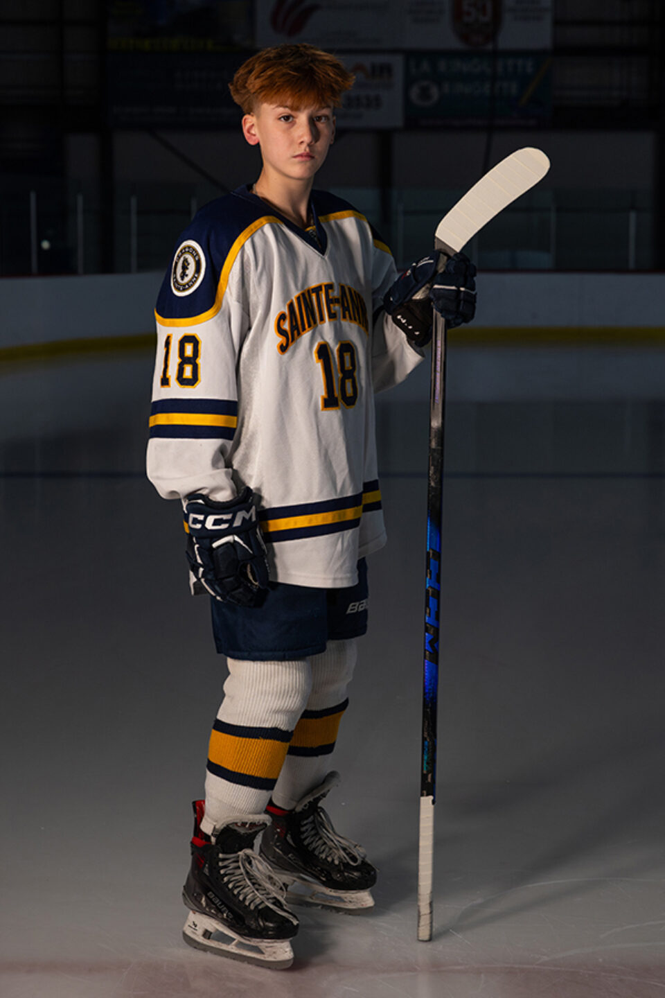 Young hockey player portrait by Montreal college sports photographer