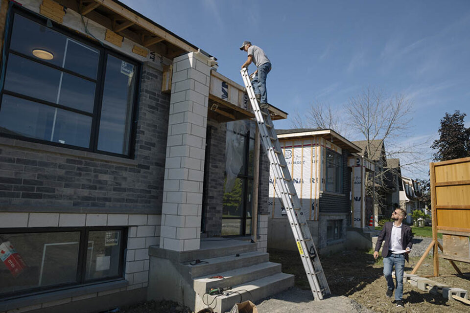 Construction site worker on ladder