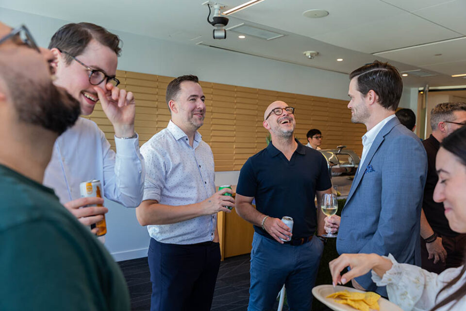Guests laughing at corporate networking event