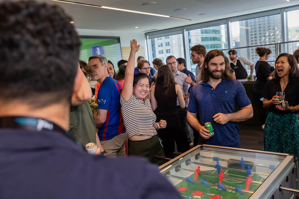 Celebrating during a gam of foosball, Montreal corporate event