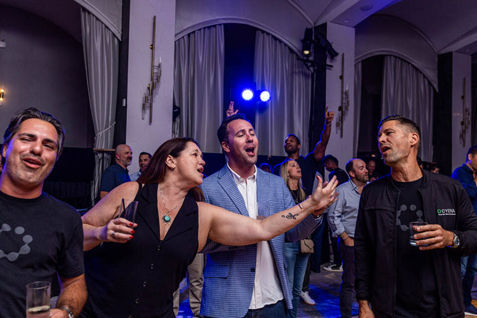 Event delegates enjoy a karaoke session